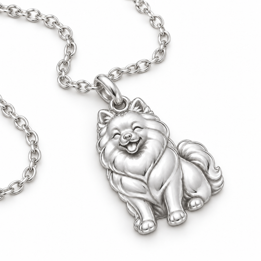 Angled close up of a sterling silver Happy Pup charm necklace showing detailed fur textures.