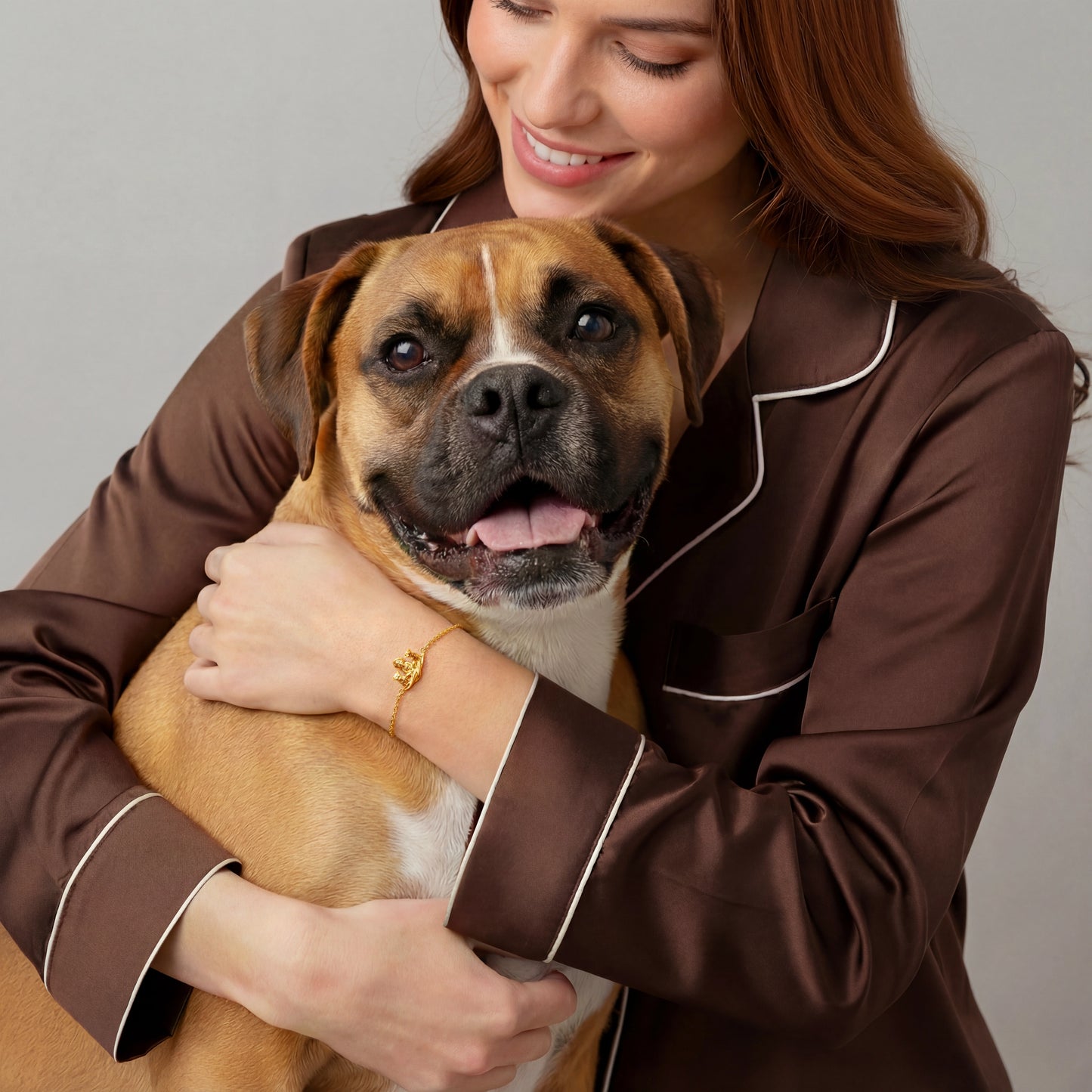 Woman wearing personalized dog bracelet while holding her dog