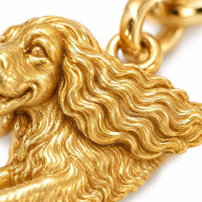 Super macro surface detail of 200+ Dog Breeds Little Love Charm Only – 18K Gold Vermeil from a low oblique angle