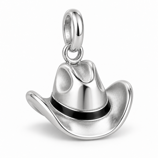 Side view of a polished silver cowboy hat pendant showing the detailed brim and crown.