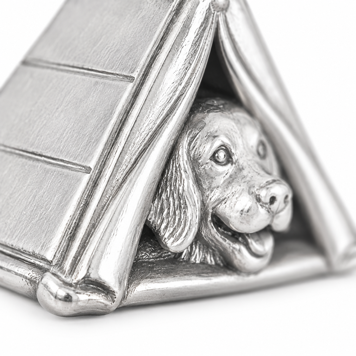 Super macro surface detail of Camping Companion Charm from a low oblique angle