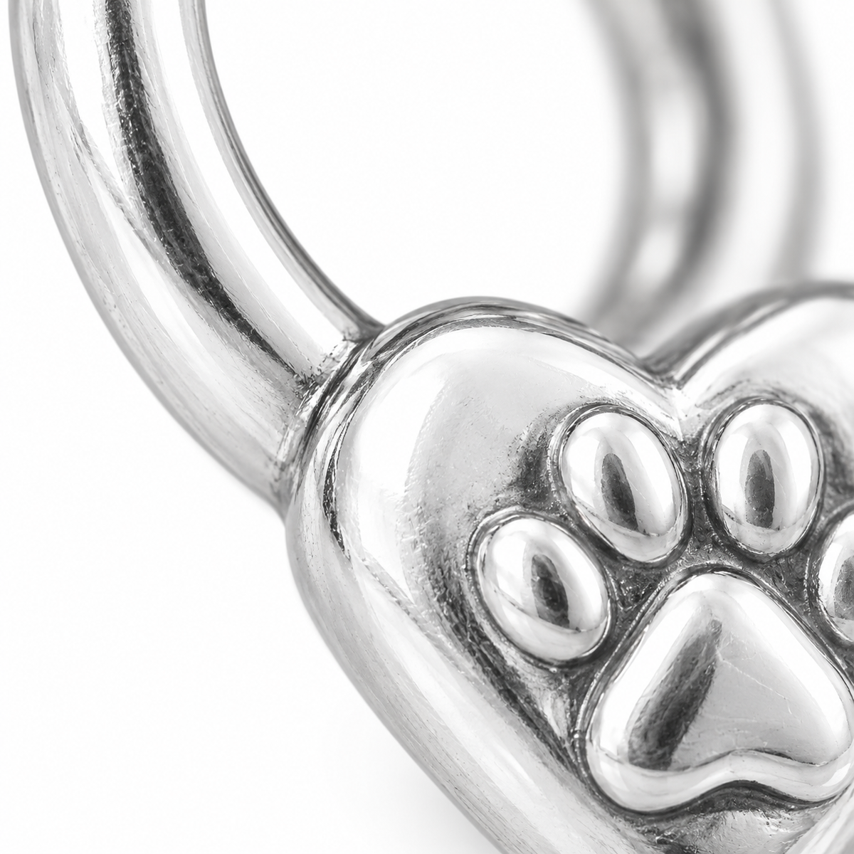 Super macro surface detail of Forever Linked Charm from a low oblique angle