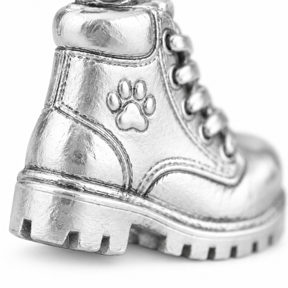 Super macro surface detail of Adventure Boots Charm from a low oblique angle