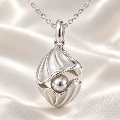 Shell and Pearl charm close-up on soft satin