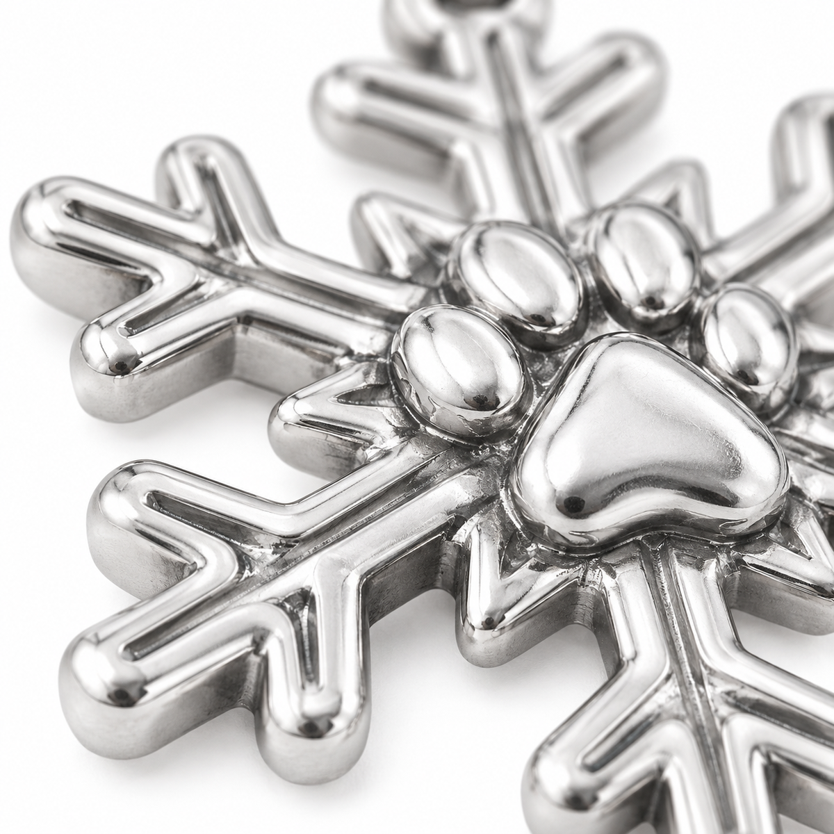 Super macro surface detail of Snowflake Paw Charm from a low oblique angle