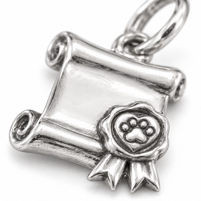 Super macro surface detail of Adoption Promise Charm from a low oblique angle