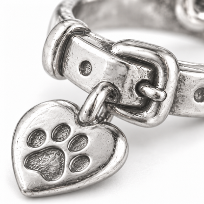 Super macro surface detail of First Collar Keepsake Charm from a low oblique angle