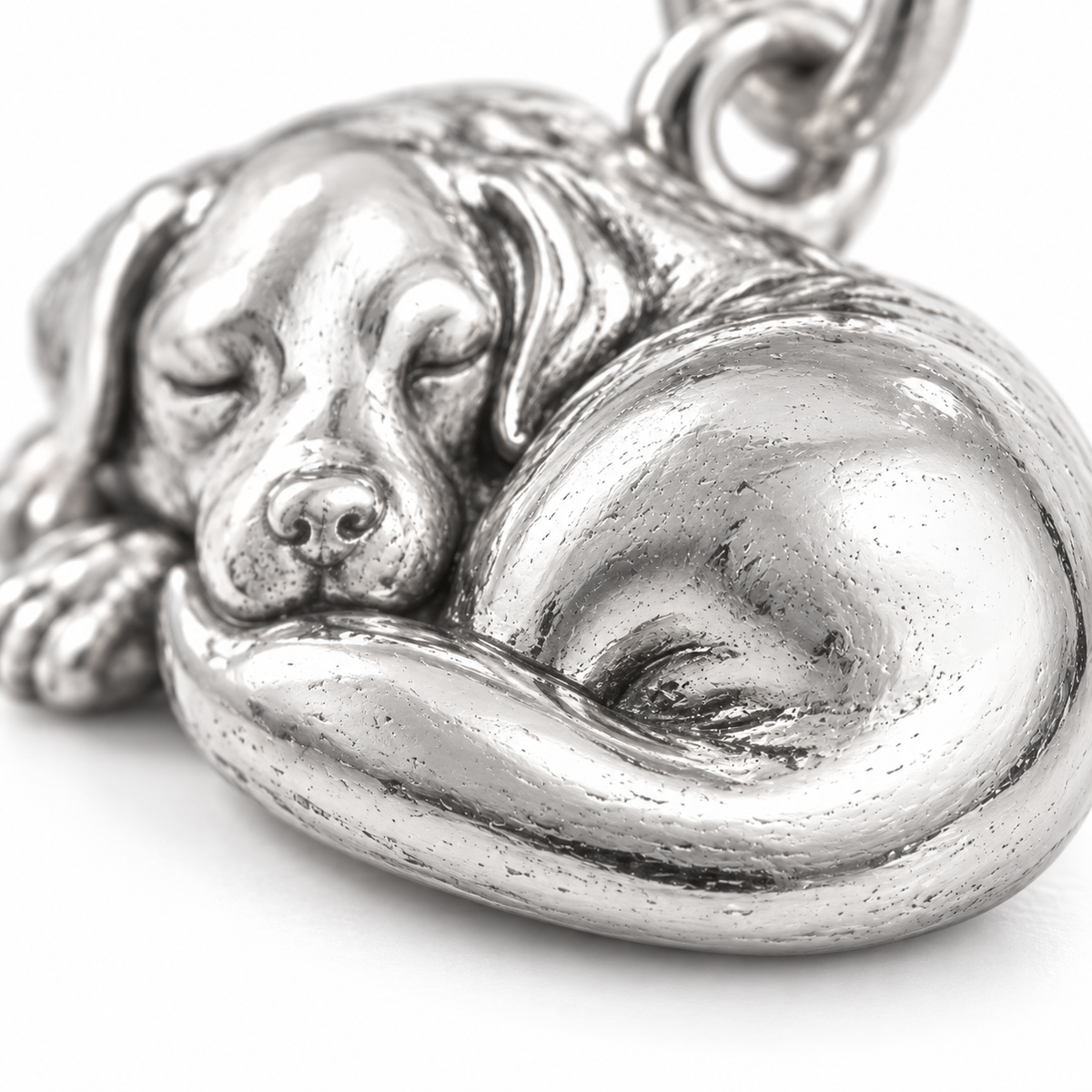 Super macro surface detail of Sleepy Sidekick Charm from a low oblique angle