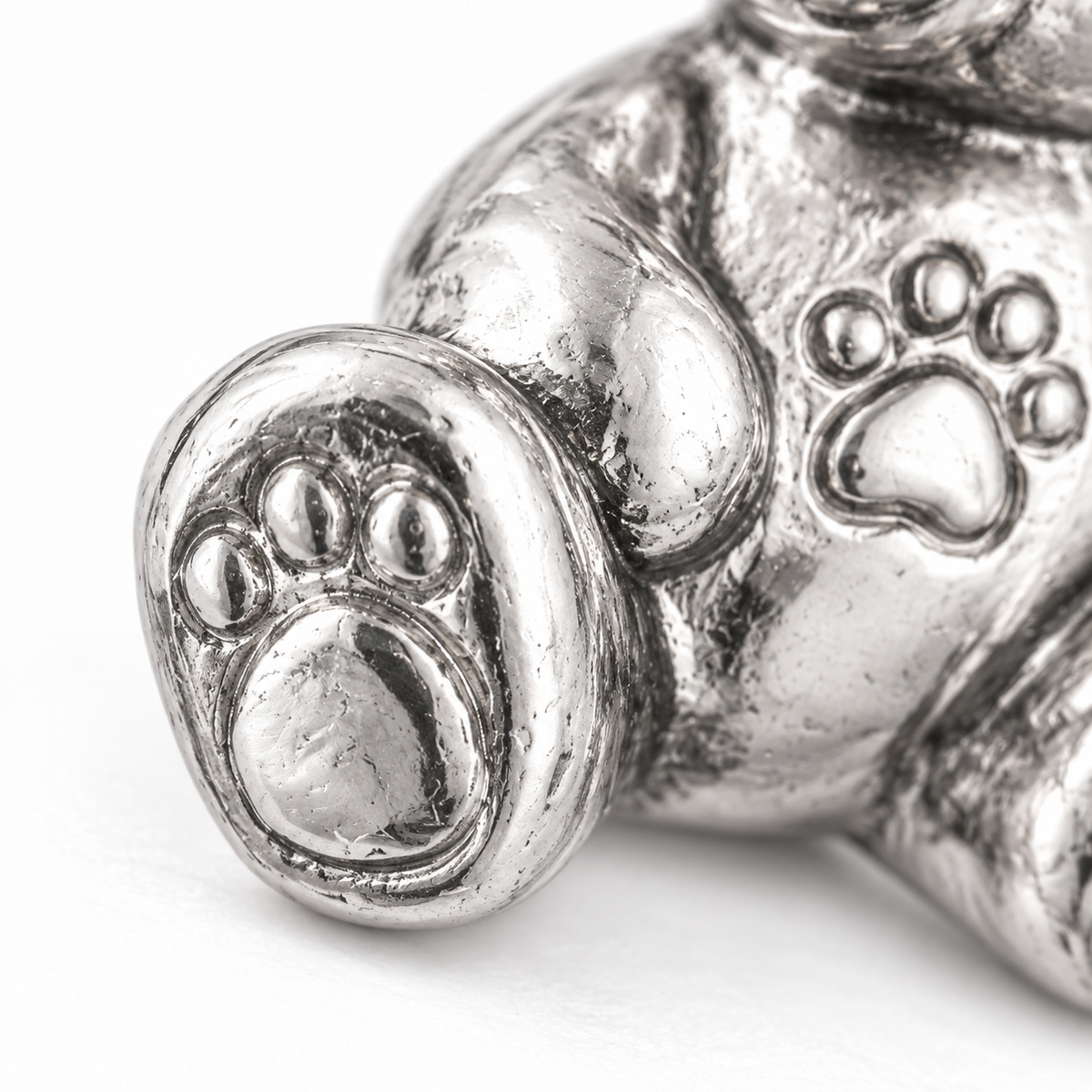 Super macro surface detail of Beloved Teddy Charm from a low oblique angle