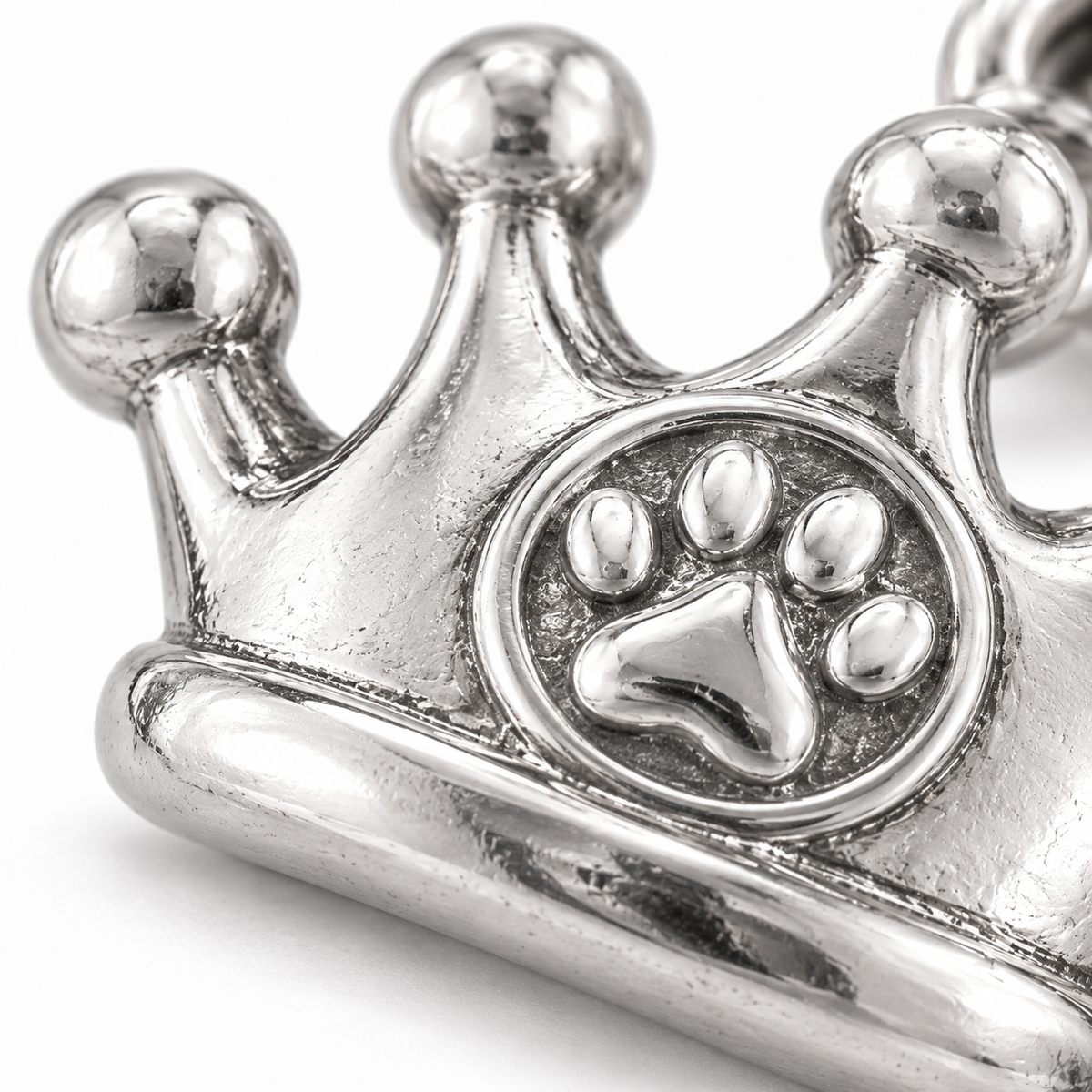 Super macro surface detail of Birthday Royalty Charm from a low oblique angle