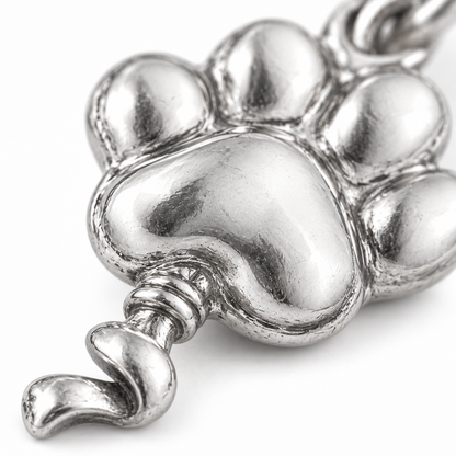Super macro surface detail of Paws Up Balloon Charm from a low oblique angle