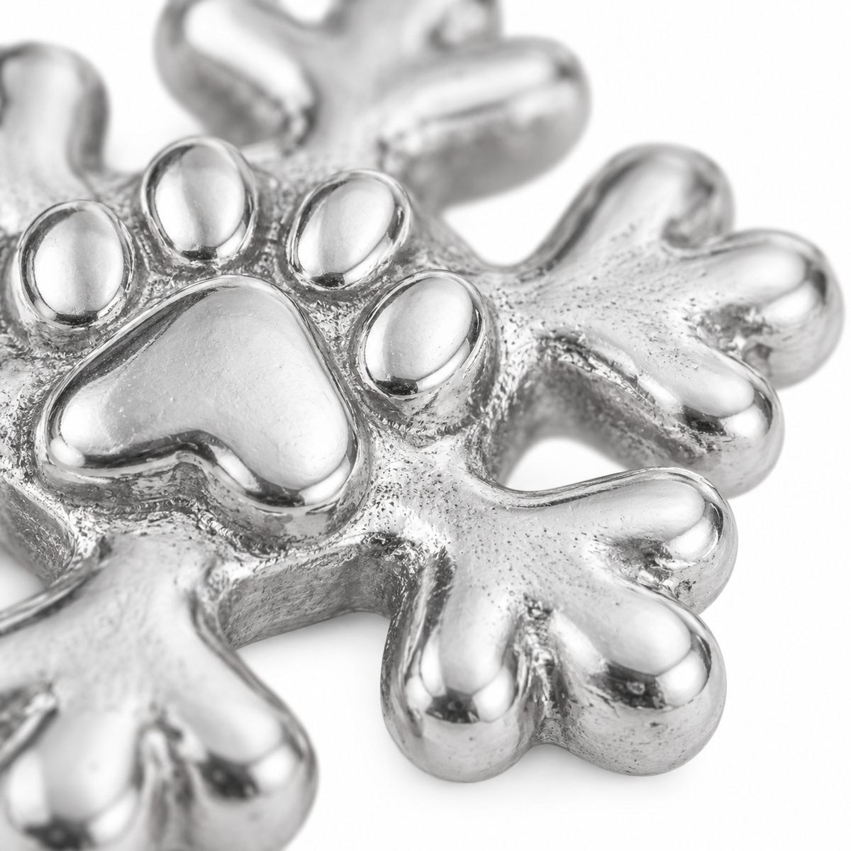 Super macro surface detail of First Snow Paw Charm from a low oblique angle