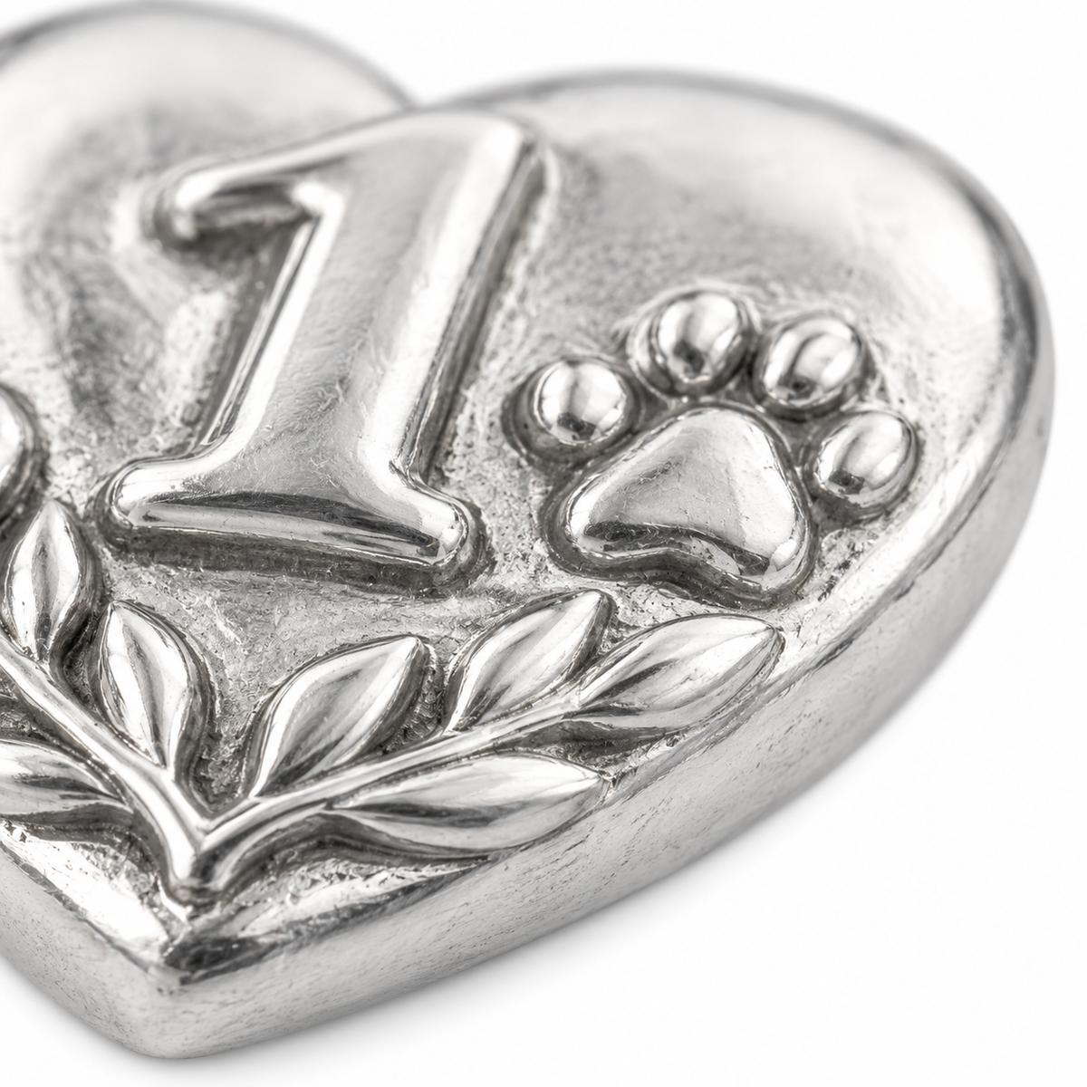Super macro surface detail of Our First Year Charm from a low oblique angle