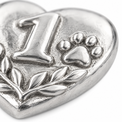 Super macro surface detail of Our First Year Charm from a low oblique angle