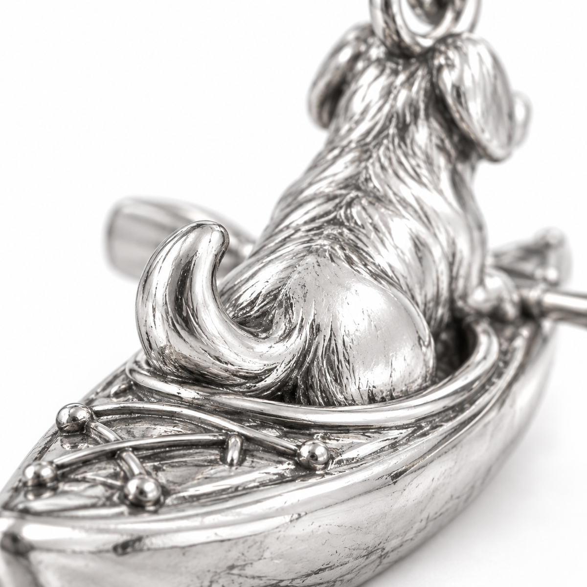 Super macro surface detail of Kayak Companion Charm from a low oblique angle
