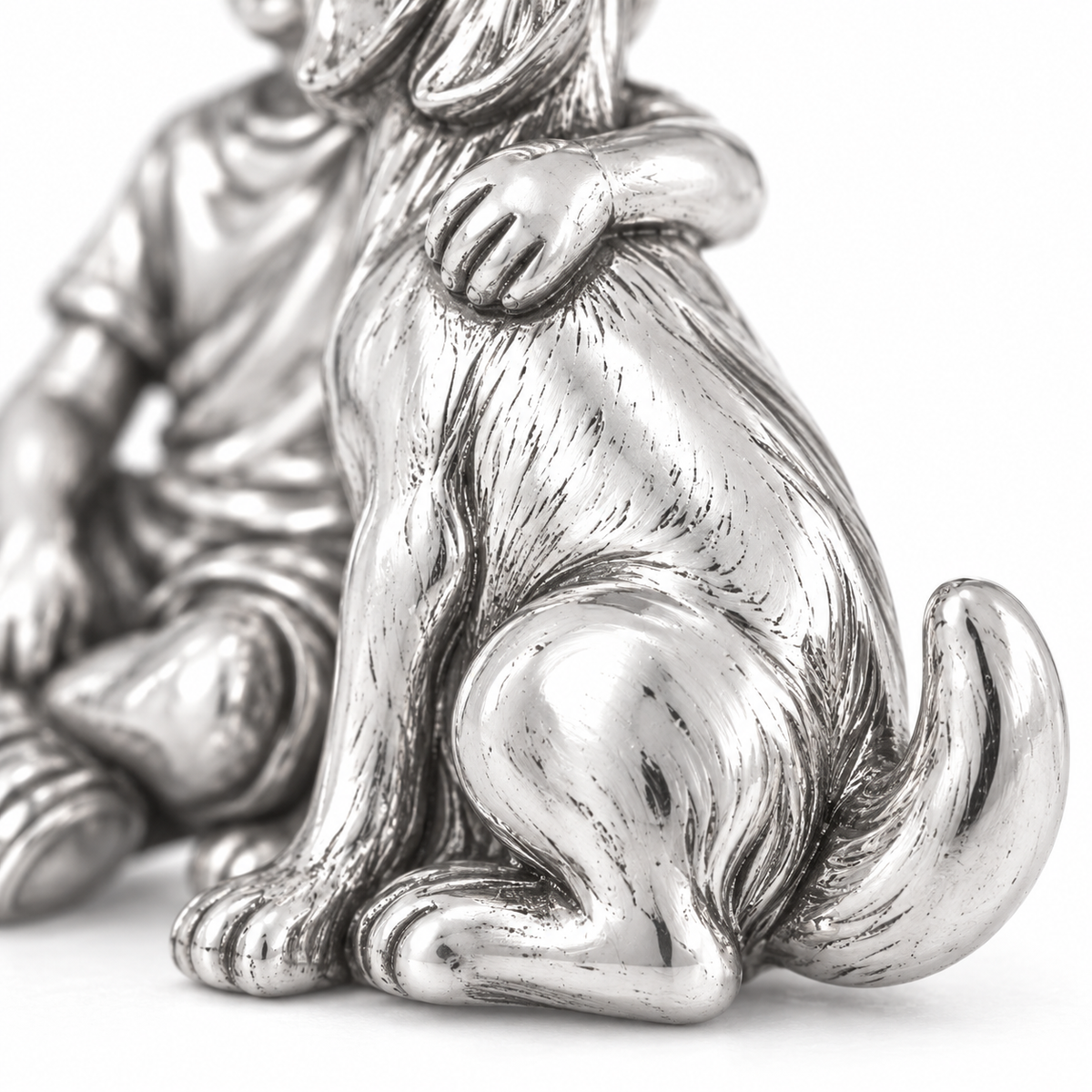 Super macro surface detail of Boy and His Best Friend Charm from a low oblique angle