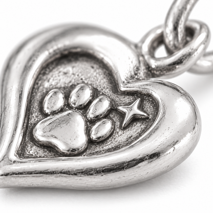 Super macro surface detail of Carried in My Heart Charm from a low oblique angle