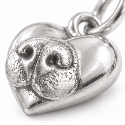 Super macro surface detail of Noseprint Forever Charm from a low oblique angle