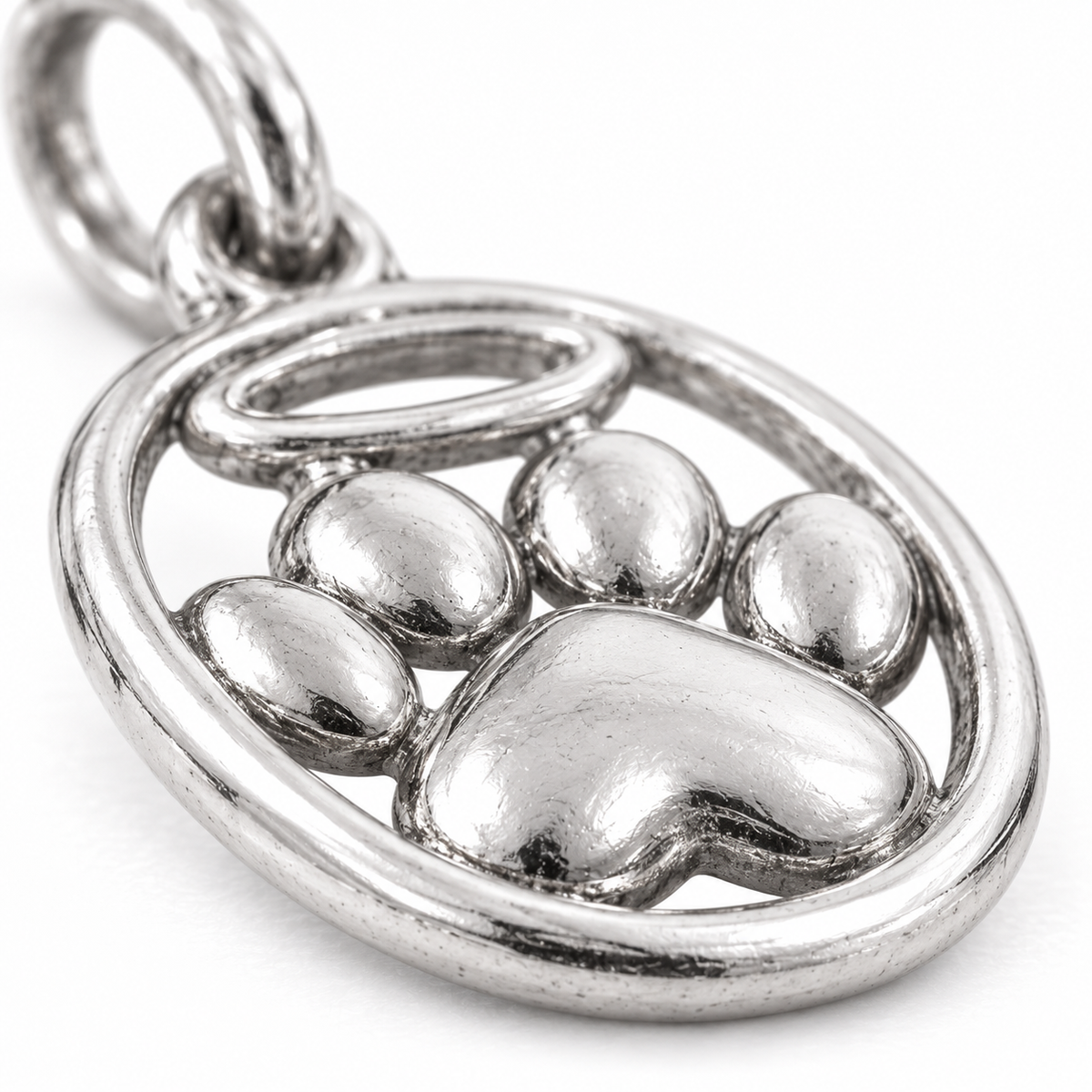 Super macro surface detail of Halo of Love Paw Charm from a low oblique angle