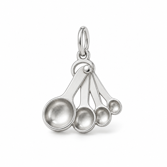 Sterling silver measuring spoon fan charm featuring four different sized spoons on a jump ring.