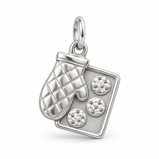 Sterling silver Oven Mitt and Cookie Tray Charm featuring a quilted texture and three detailed cookies.