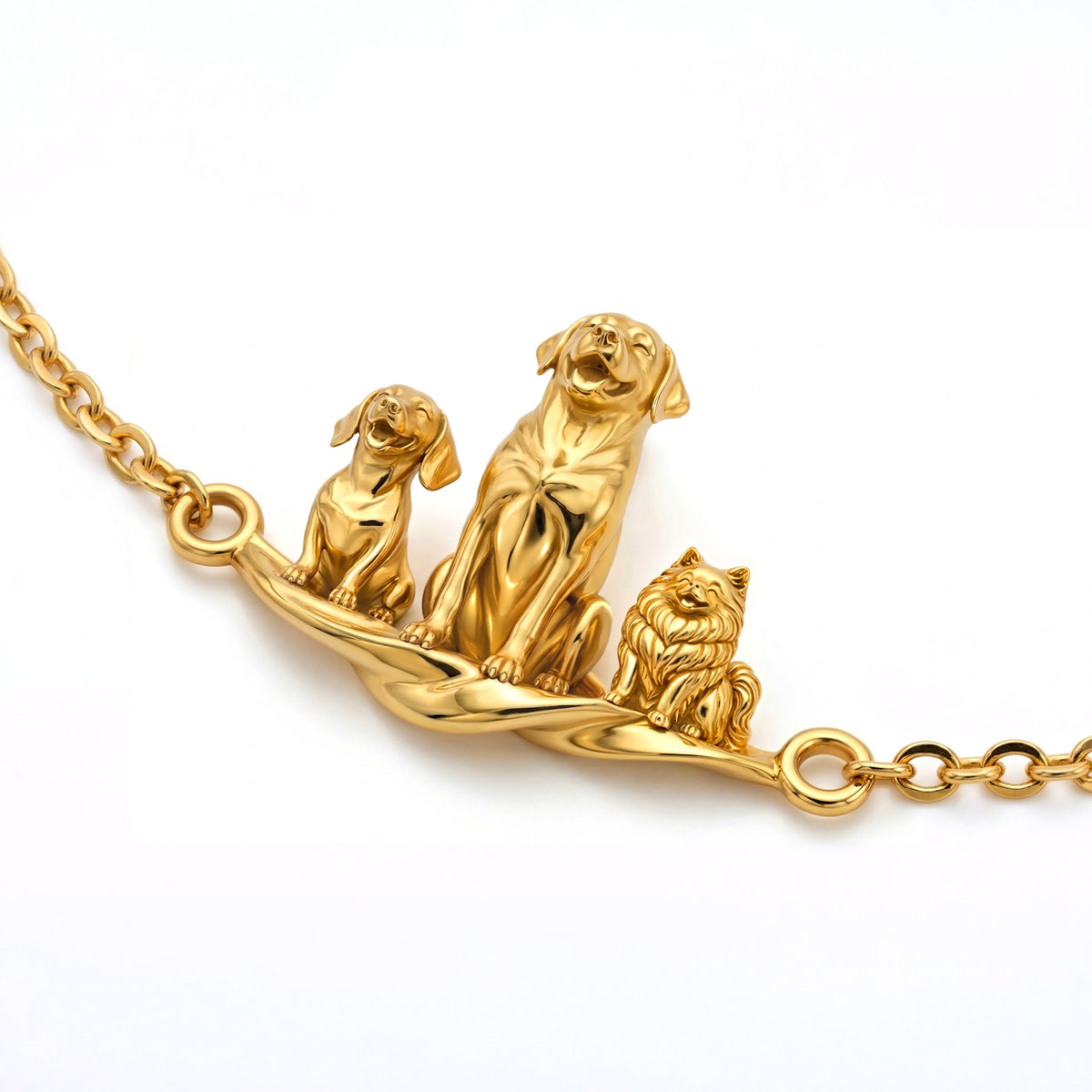 Detailed view of the gold personalized pet bracelet showing a Labrador and two smaller dog breeds.