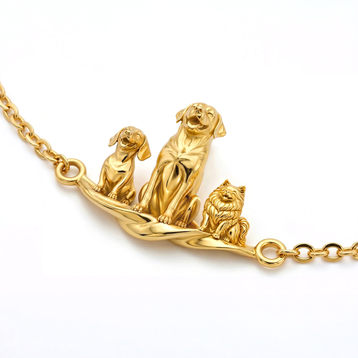 Close up of a gold vermeil Eternal Paw Bracelet featuring three detailed 3D sculpted dog figures.