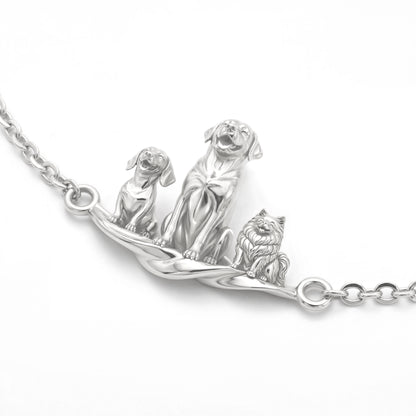 Polished silver pet lover bracelet showcasing three different 3D dog figures with realistic fur textures.