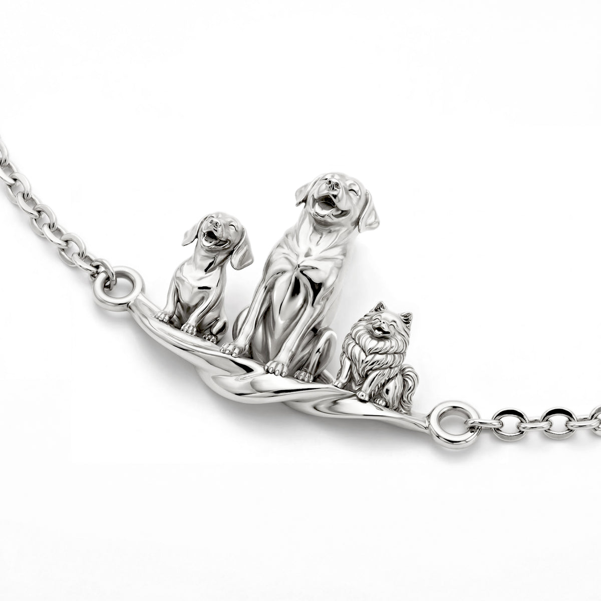 Sterling silver Eternal Paw Bracelet with three handcrafted 3D pet figures on a delicate link chain.