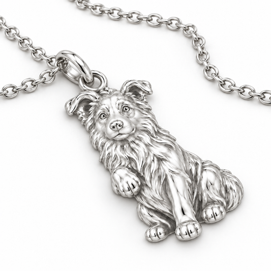 Close up view of a silver dog breed charm showing detailed fur texture and puppy pose.
