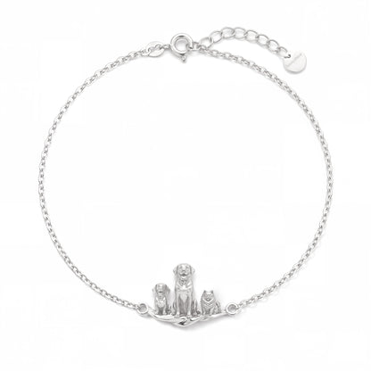 Handcrafted silver bracelet for pet lovers featuring three custom 3D dog charms and adjustable sizing links.