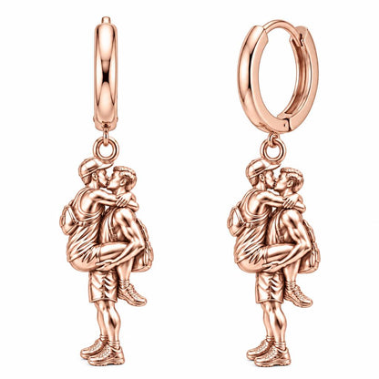 Adventurous Love Embrace Huggie Charm Earrings – rose gold, front view