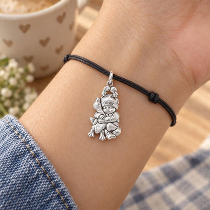 Baby Snuggling Goose Charm Bracelet – Personalized Mom Gift – worn on the wrist on a black cord bracelet