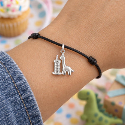 Birthday Dino Party Charm Bracelet – Personalized Mom Gift – worn on the wrist on a black cord bracelet
