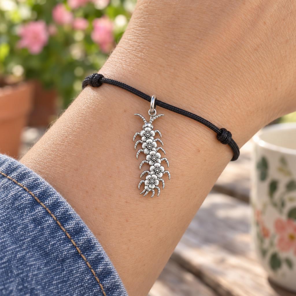 Blooming Centipede Charm Bracelet – Personalized Nature Gift – worn on the wrist on a black cord bracelet
