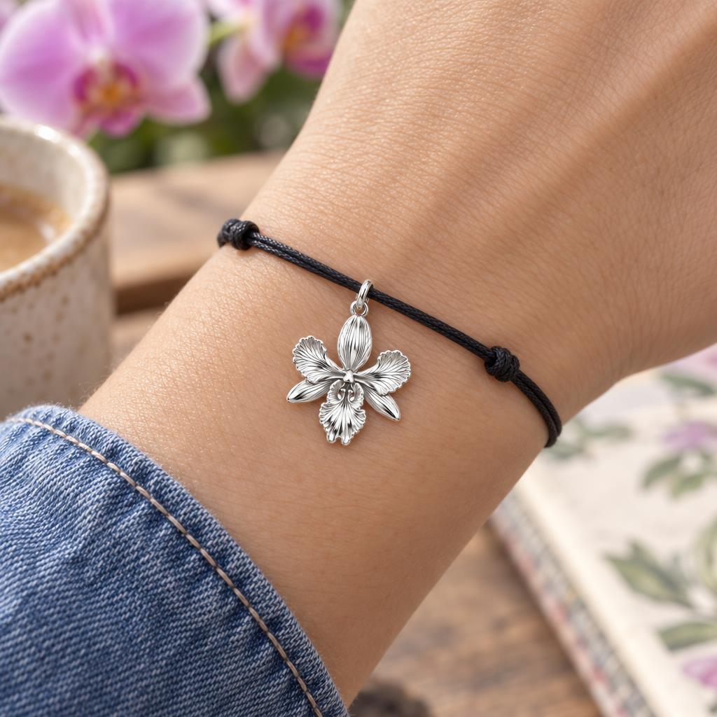 Blooming Orchid Charm Bracelet – Personalized Mom Gift – worn on the wrist on a black cord bracelet