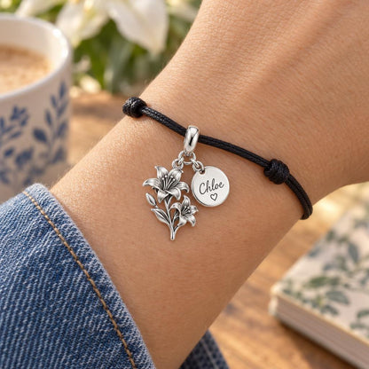Blooming With You – Personalized Birth Flower & Name Charm – worn on the wrist on a black cord bracelet