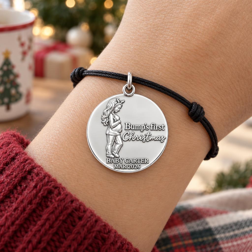Bump's First Christmas Charm Bracelet – Personalized Mom Gift – worn on the wrist on a black cord bracelet