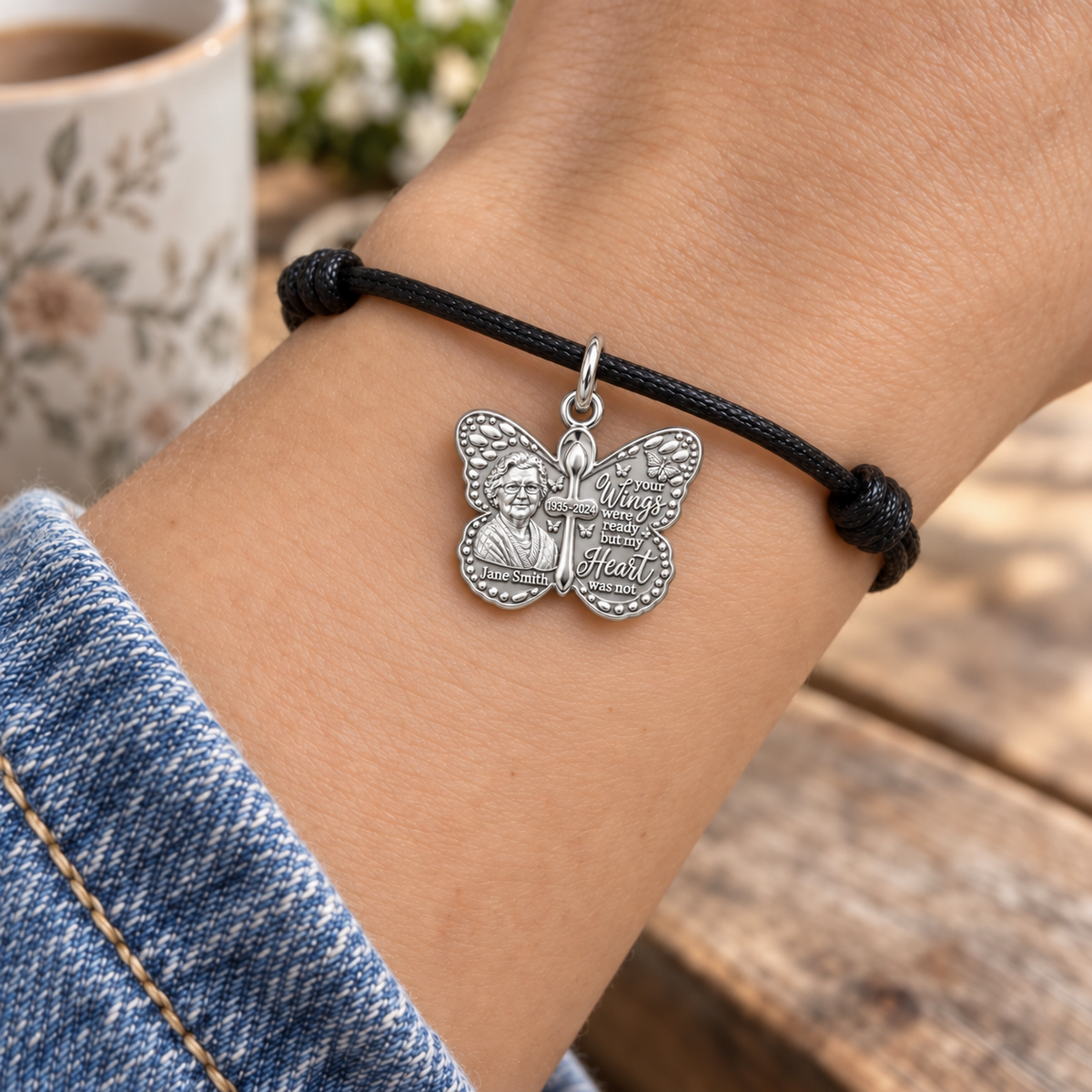 Butterfly Wings Memorial Charm Bracelet – Personalized Bereavement – worn on the wrist on a black cord bracelet