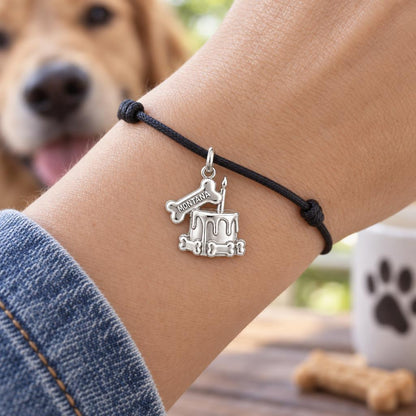 Dog Birthday Cake Charm Bracelet – Personalized Dog Mom Gift – worn on the wrist on a black cord bracelet