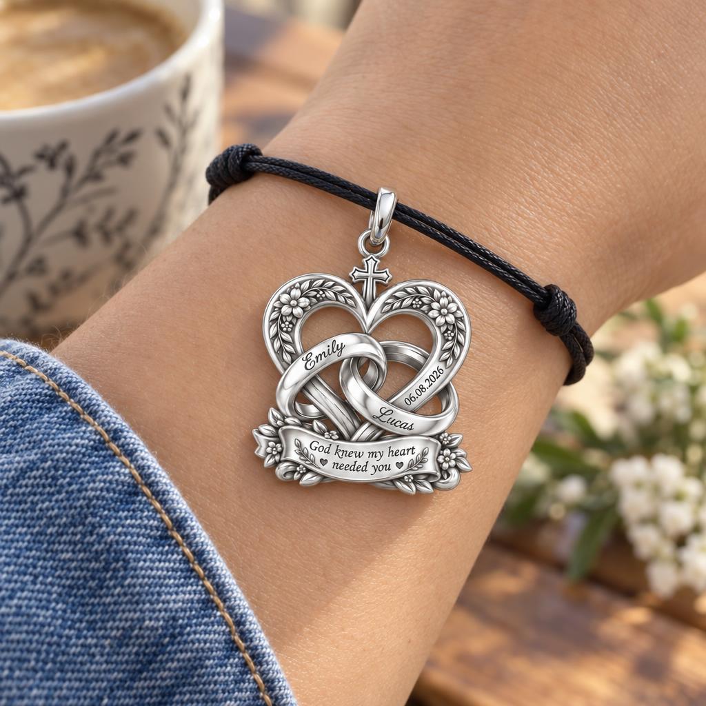 Entwined Hearts and Cross Charm Bracelet – Personalized Couple Gift – worn on the wrist on a black cord bracelet