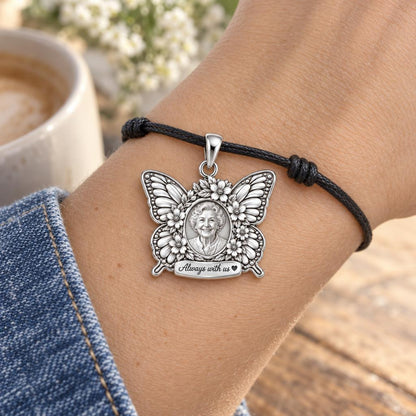 Eternal Butterfly Portrait Charm Bracelet – Personalized Memorial Gift – worn on the wrist on a black cord bracelet