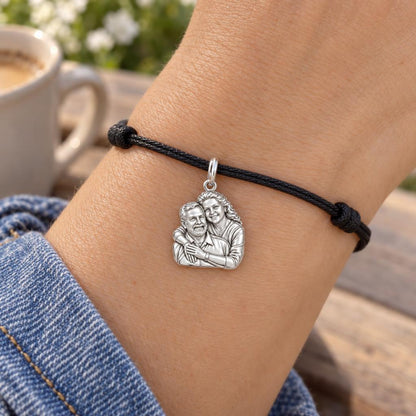Eternal Embrace Photo Charm Bracelet – Personalized Couple Gift – worn on the wrist on a black cord bracelet
