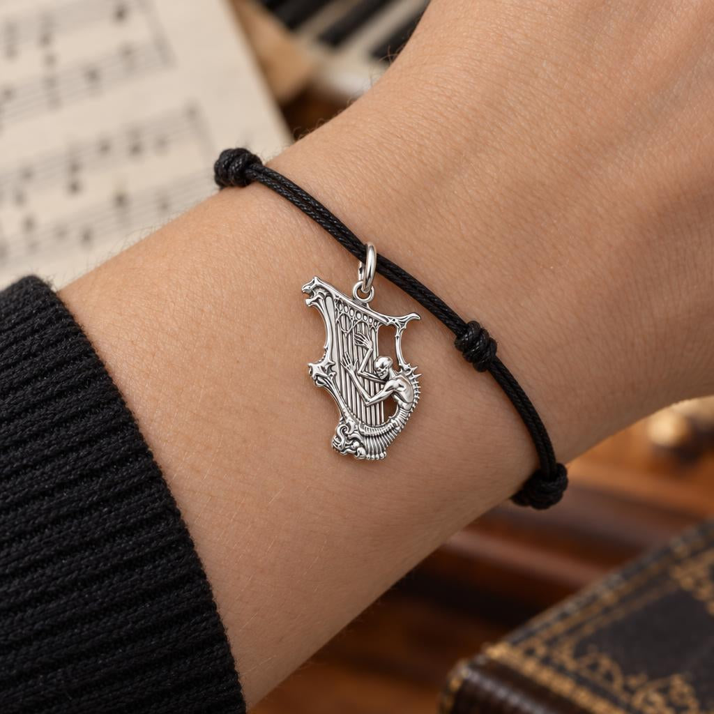 Eternal Skeleton Harpist Charm Bracelet – Personalized Musician Gift – worn on the wrist on a black cord bracelet