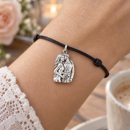 Eternal Wedding Embrace Charm Bracelet – Personalized Couple Gift – worn on the wrist on a black cord bracelet