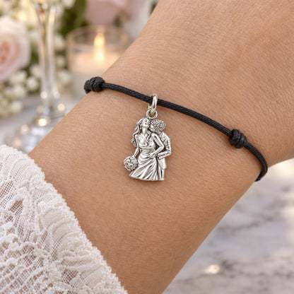 Eternal Wedding Embrace Charm Bracelet – Personalized Couple Gift – worn on the wrist on a black cord bracelet