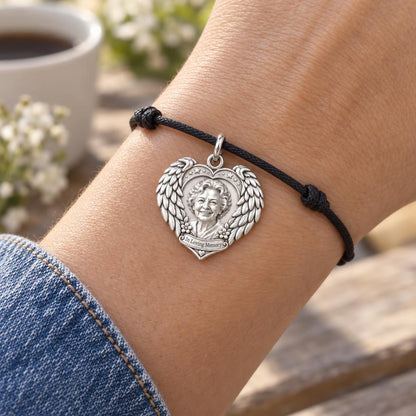 Eternal Wings Memorial Heart Charm Bracelet – Personalized Memorial – worn on the wrist on a black cord bracelet