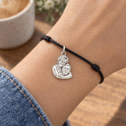 Everlasting Embrace Charm Bracelet – Personalized Couple Gift – worn on the wrist on a black cord bracelet
