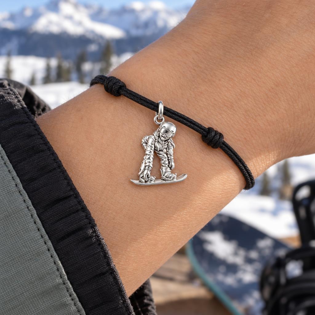 Every Slope, A Memory – Custom Skiing & Snowboarding Charm – worn on the wrist on a black cord bracelet