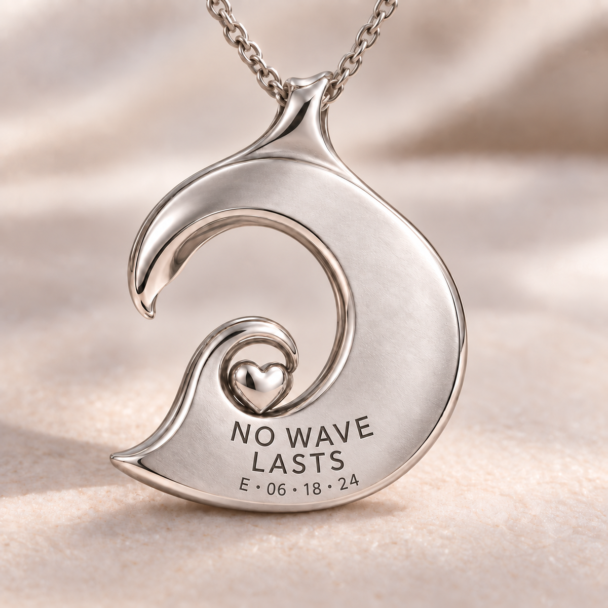 Wave Heart charm back engraving with No Wave Lasts and a personalized date